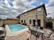 A private backyard featuring a refreshing pool, patio seating, and well-maintained landscaping at 8504 E Lindner Ave, Mesa, AZ 85209
