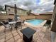 A private backyard featuring a refreshing pool, patio seating, and well-maintained landscaping at 8504 E Lindner Ave, Mesa, AZ 85209