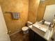 Bathroom featuring decorative walls, floating sink and an oversized mirror at 8504 E Lindner Ave, Mesa, AZ 85209