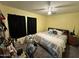 Well-lit bedroom features a full bed and personal desk area at 8504 E Lindner Ave, Mesa, AZ 85209