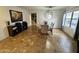 Bright and airy dining area featuring a large window and stylish tile floors at 8504 E Lindner Ave, Mesa, AZ 85209