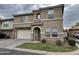 Two-story home with a two car garage and arched front entry on a cloudy day at 8504 E Lindner Ave, Mesa, AZ 85209