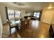Open-concept living room and dining area with large windows that offer great natural light at 8504 E Lindner Ave, Mesa, AZ 85209
