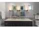 Bathroom featuring double sinks and quartz countertops at 8719 E San Marcos Dr, Scottsdale, AZ 85258