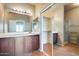 En suite bathroom features updated cabinets and a mirror. Closet and shower stall are shown at 900 S 94Th St # 1204, Chandler, AZ 85224
