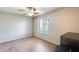 Bright, airy bedroom featuring neutral paint, tiled floors, ceiling fan, and natural light at 900 S 94Th St # 1204, Chandler, AZ 85224