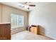 Comfortable bedroom with neutral walls, tiled floors, ceiling fan, and bright natural light at 900 S 94Th St # 1204, Chandler, AZ 85224