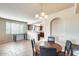 Open-concept dining room featuring tile floors, decorative lighting, and seamless kitchen access at 900 S 94Th St # 1204, Chandler, AZ 85224
