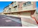 Attached garages, each with a garage door, and a paved brick driveway shown at 900 S 94Th St # 1204, Chandler, AZ 85224