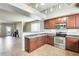 Spacious kitchen with stainless steel appliances flows to an open-concept living area at 900 S 94Th St # 1204, Chandler, AZ 85224
