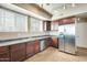Well-lit kitchen with stainless steel appliances, tile floors, and ample counter space at 900 S 94Th St # 1204, Chandler, AZ 85224