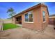 View of the backyard highlighting the artificial turf and outdoor living space at 9295 W Wood Dr, Peoria, AZ 85381