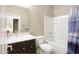 Bright bathroom featuring a single sink vanity, tub/shower combo, and neutral finishes providing a calming space at 9295 W Wood Dr, Peoria, AZ 85381