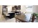 Dining area featuring an adjacent island, modern pendant lighting and stainless steel appliances at 9295 W Wood Dr, Peoria, AZ 85381