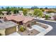 Stunning single-Gathering home boasts desert landscaping, a two-car garage, and a charming stone entrance at 9295 W Wood Dr, Peoria, AZ 85381