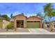 Inviting single-Gathering home with stone accents, desert landscaping, and a two-car garage at 9295 W Wood Dr, Peoria, AZ 85381