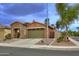 Charming single-Gathering home with desert landscaping and a two-car garage at 9295 W Wood Dr, Peoria, AZ 85381