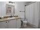 Bathroom featuring granite countertop, white vanity and cabinet with shower and toilet at 9451 E Becker Ln # 1041, Scottsdale, AZ 85260