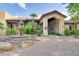 Welcoming clubhouse entrance with a decorative fountain and well-maintained landscaping at 9451 E Becker Ln # 1041, Scottsdale, AZ 85260