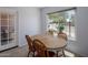 Bright dining area featuring a wood table, seating for four, with view to outside at 9451 E Becker Ln # 1041, Scottsdale, AZ 85260