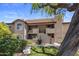 Exterior of a building with a mature tree, balconies, and green grass in the front at 9451 E Becker Ln # 1041, Scottsdale, AZ 85260