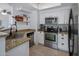 Kitchen features stainless steel appliances, white cabinets, granite countertops, and a stylish faucet at 9451 E Becker Ln # 1041, Scottsdale, AZ 85260