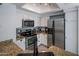 Modern kitchen with stainless steel appliances, white cabinets, granite countertops, and lots of light at 9451 E Becker Ln # 1041, Scottsdale, AZ 85260
