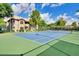 Well-maintained community tennis court surrounded by lush greenery and clear blue skies at 9451 E Becker Ln # 1041, Scottsdale, AZ 85260