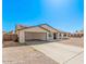 A single-story home features a covered carport, solar panels, and a low-maintenance yard at 9903 N 87Th Dr, Peoria, AZ 85345