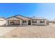 Charming single-story home featuring a carport, solar panels, and low-maintenance landscaping at 9903 N 87Th Dr, Peoria, AZ 85345
