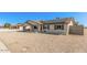 Well-maintained single-story home with solar panels, gravel landscaping, and a convenient carport at 9903 N 87Th Dr, Peoria, AZ 85345