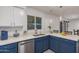 Modern kitchen with quartz countertops, stainless steel appliances, and ample storage space at 9903 N 87Th Dr, Peoria, AZ 85345