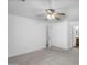 Neutral bedroom with a ceiling fan, carpet flooring, and doors to adjacent rooms at 10132 E Isleta Ave, Mesa, AZ 85209