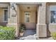 Charming front porch with a welcome mat, address numbers, and a cozy seating area at 10132 E Isleta Ave, Mesa, AZ 85209