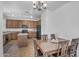 Well-appointed kitchen featuring wood cabinetry, granite countertops, and an island for extra prep space at 10132 E Isleta Ave, Mesa, AZ 85209