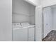Functional laundry room with washer and dryer, plus added shelving at 10132 E Isleta Ave, Mesa, AZ 85209