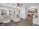 Bright living area showcasing wood floors, comfortable seating, and open access to the kitchen at 10132 E Isleta Ave, Mesa, AZ 85209