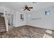 Second living area with stairs, wood floors and windows with neighborhood views at 10132 E Isleta Ave, Mesa, AZ 85209
