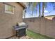 Outdoor grill area with gas barbecue on a paved patio surrounded by decorative plants at 10132 E Isleta Ave, Mesa, AZ 85209