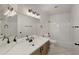 Well-lit bathroom with a vanity featuring a large mirror and neutral finishes at 10160 E Conieson Rd, Scottsdale, AZ 85260