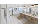 Well-lit bathroom with walk-in shower, soaking tub, and dual sinks at 10160 E Conieson Rd, Scottsdale, AZ 85260