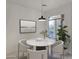Dining space featuring modern table, chairs, decor, and window with natural light at 10160 E Conieson Rd, Scottsdale, AZ 85260