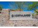 A stone community entrance sign reads 'Northlands' under a blue sky and mature trees at 10251 W Gambit Trl, Peoria, AZ 85383