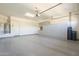 A spacious garage area with ample storage cabinets and room for multiple vehicles at 10251 W Gambit Trl, Peoria, AZ 85383