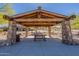 A shady community picnic area provides a gathering space with a wooden pavilion and views of the neighborhood at 10251 W Gambit Trl, Peoria, AZ 85383