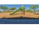 Community playground with a green slide and swing set, perfect for Gathering fun and outdoor activities at 10251 W Gambit Trl, Peoria, AZ 85383