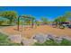 Neighborhood playground featuring swings and a slide, providing a recreational area for children and families at 10251 W Gambit Trl, Peoria, AZ 85383