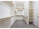 This walk-in closet provides ample storage with shelving and rods, maximizing organization at 10251 W Gambit Trl, Peoria, AZ 85383