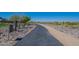 Scenic community walking path with desert landscaping, ideal for leisurely strolls and outdoor exercise at 10251 W Gambit Trl, Peoria, AZ 85383