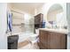 Bathroom featuring a modern shower/tub and updated vanity at 10326 W Kingswood Cir, Sun City, AZ 85351